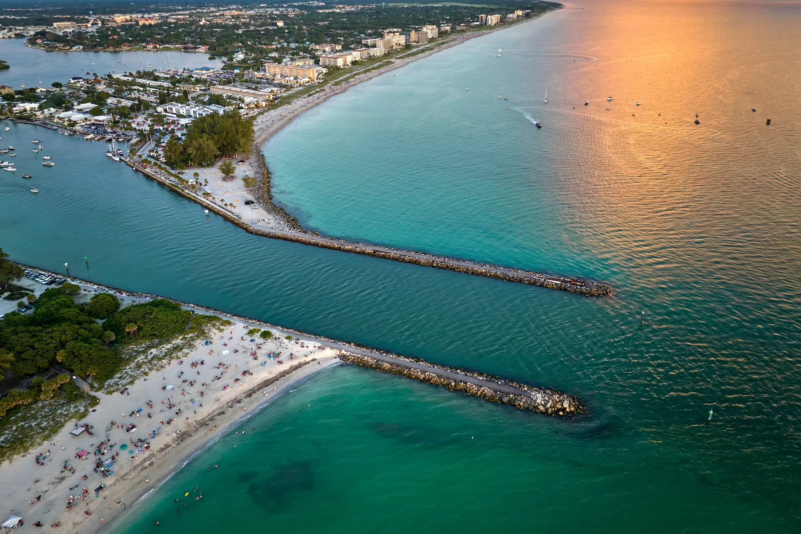 Aerial beach inlet jetty sunset 1600