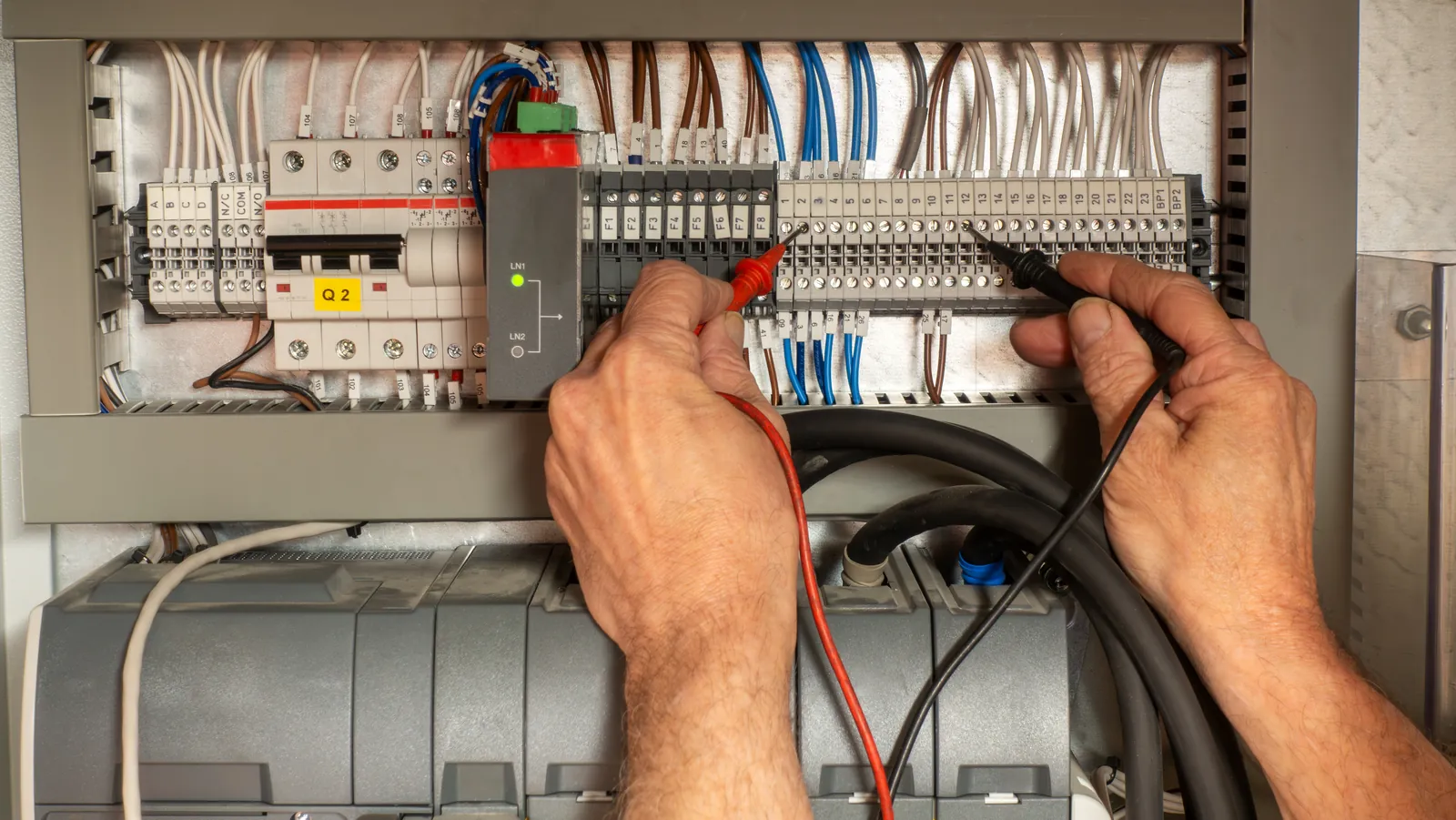 Electrician wiring commercial panel 1600