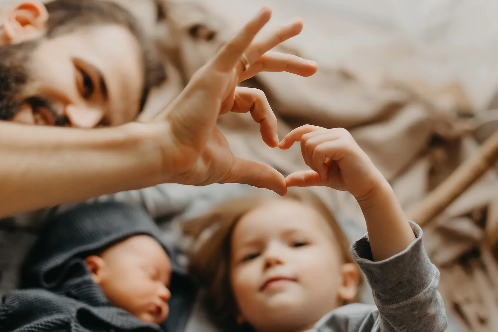 Family hands heart with children 1600