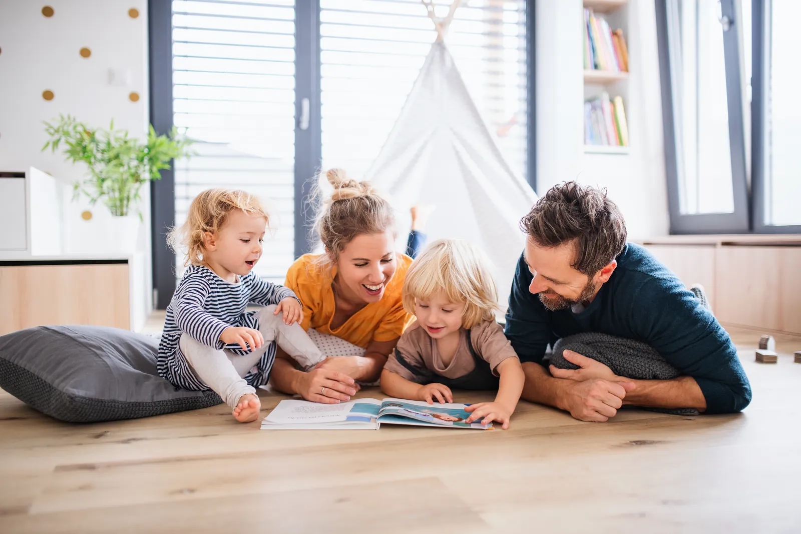 Family reading bright living room 1600