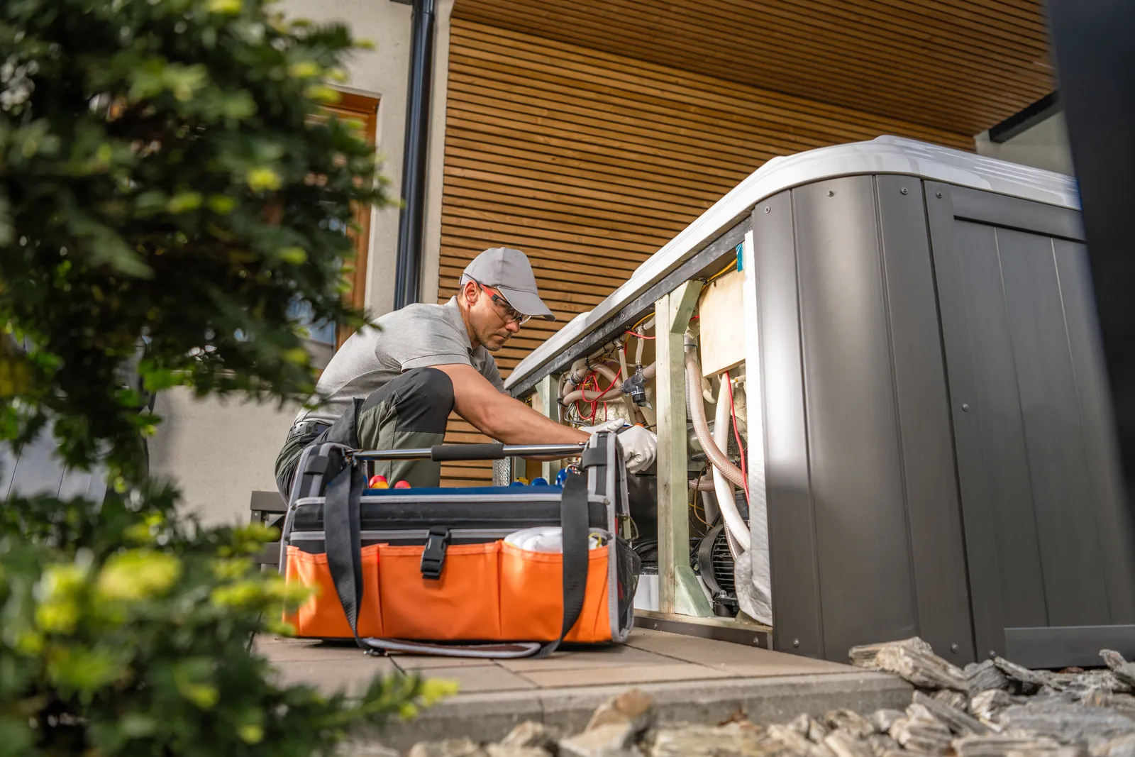 Technician servicing outdoor unit 1600